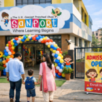 Front view of a modern preschool building in Dilshad Garden area, decorated entrance with balloons and a small “Admissions Open” standee board near the gate. Parents holding child’s hand entering the school happily. Bright morning light, clean and safe campus, CCTV camera visible subtly, welcoming environment. Professional real estate + lifestyle photography style, high resolution, natural Indian urban neighborhood background.